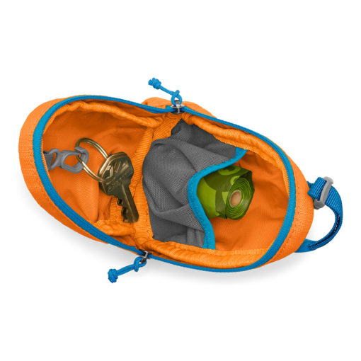 Interior of the Ruffwear Stash Bag™ pick-up bag / poo bag storage and dispensing system. Poppy Orange.